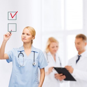 Doctor ticking of items on a checklist