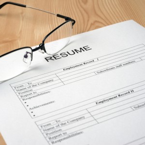 Blank resume with glasses resting over the sheet