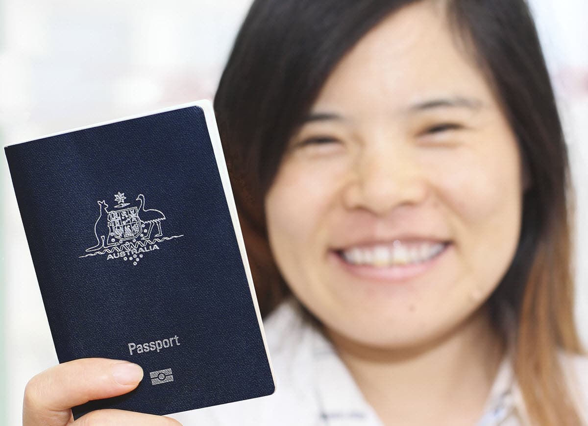 Woman holding an Australian visa