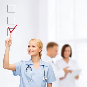 Nurse creating check list of reasons to work in the UK