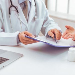 Doctor discussing medical results with female patient