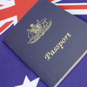 Australian passport sitting over an Australian flag
