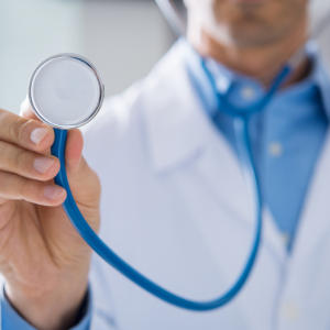 male doctor holding stethoscope