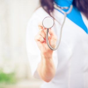 Nurse holding a stethoscope in a medical practice