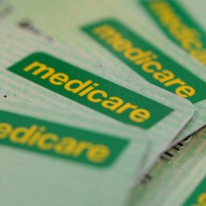 Pile of green Medicare cards