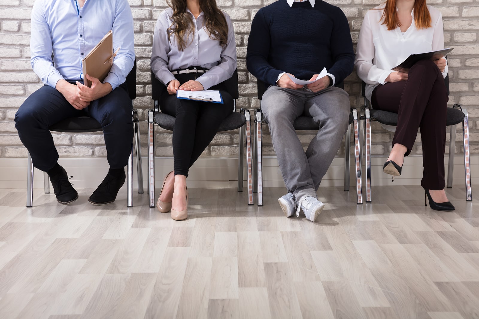 patients Sitting On Chair Waiting