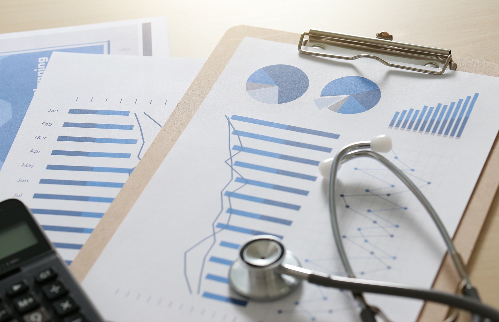 financial report chart and calculator Medical Report and stethoscope