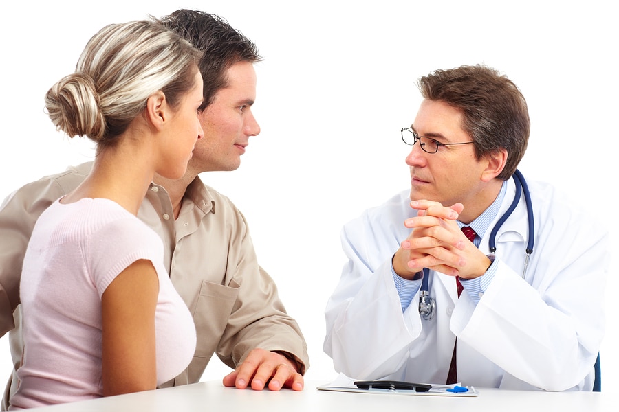 Medical doctor and young couple patients.