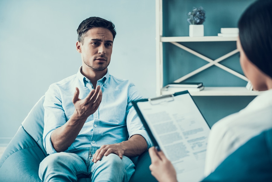 Young Upset Man At Psychologist