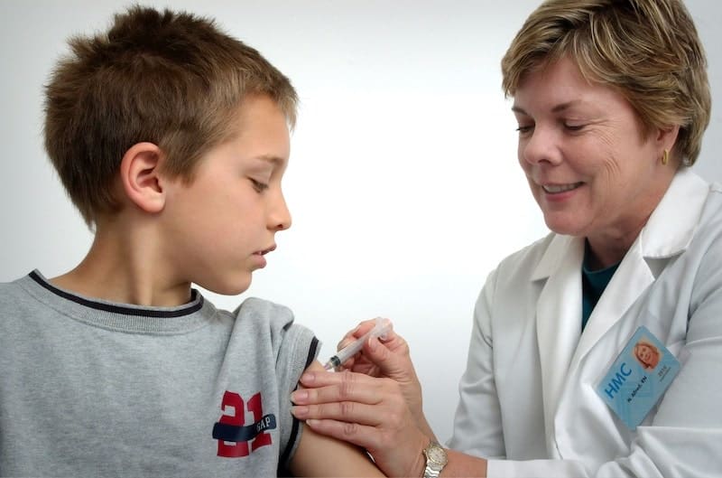 A young boy getting a vaccine 